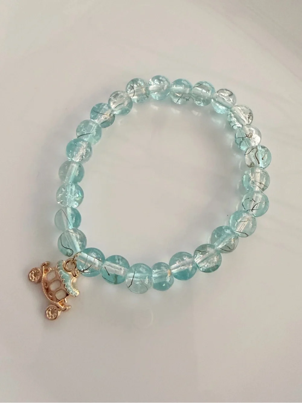 Aqua Crystal Bead Bracelet with Gold Carriage Charm